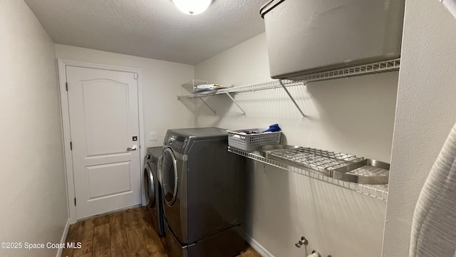 466 Stonehenge Cir, Rockledge, FL 32955 - clothes washing area with laundry area, baseboards, a textured ceiling, separate washer and dryer, and dark wood finished floors