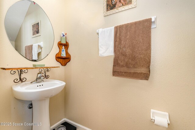 bathroom featuring baseboards