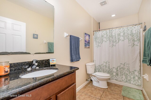 full bath featuring visible vents, tile patterned flooring, vanity, baseboards, and toilet