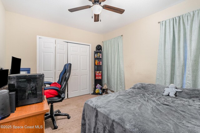 bedroom with a closet, ceiling fan, and carpet flooring