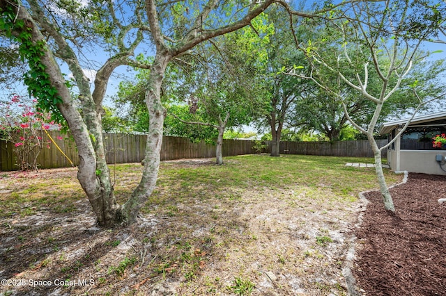 view of yard with a fenced backyard