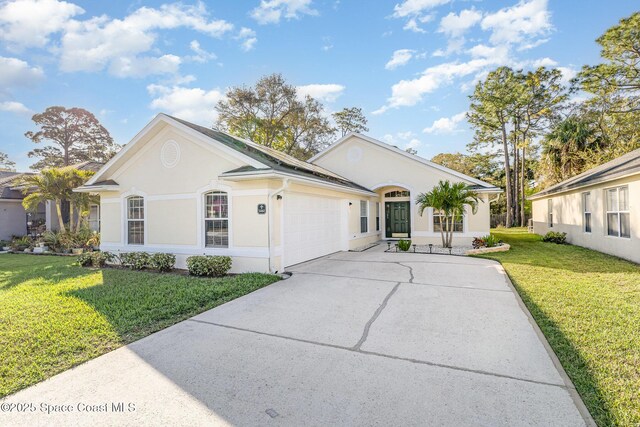 1461 Morgan Ct, Melbourne, FL 32934 - ranch-style house featuring an attached garage, a front lawn, stucco siding, and concrete driveway