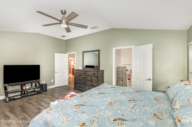 1461 Morgan Ct, Melbourne, FL 32934 - bedroom with lofted ceiling, visible vents, baseboards, and wood finished floors