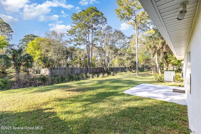 1461 Morgan Ct, Melbourne, FL 32934 - view of yard with central AC, fence, and a patio area