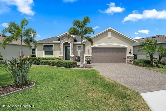 view of front of property with a front lawn, stone siding, a garage, stucco siding, and decorative driveway