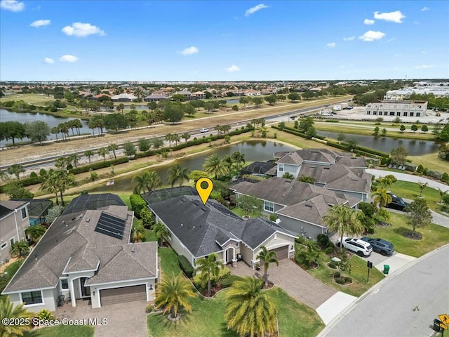 aerial view with a residential view and a water view
