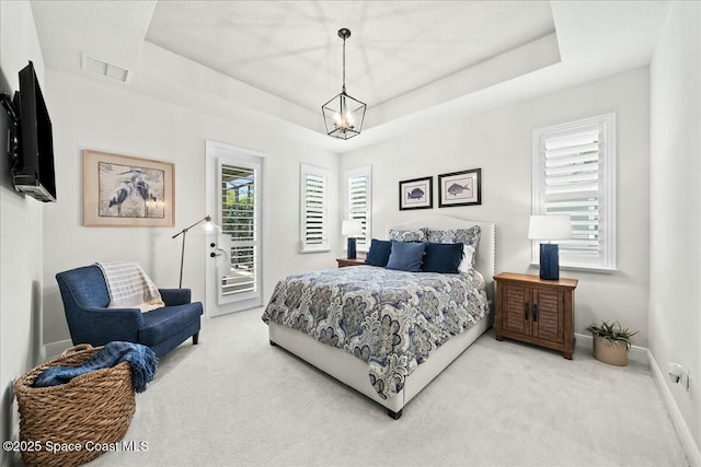 bedroom with access to outside, visible vents, baseboards, carpet flooring, and multiple windows