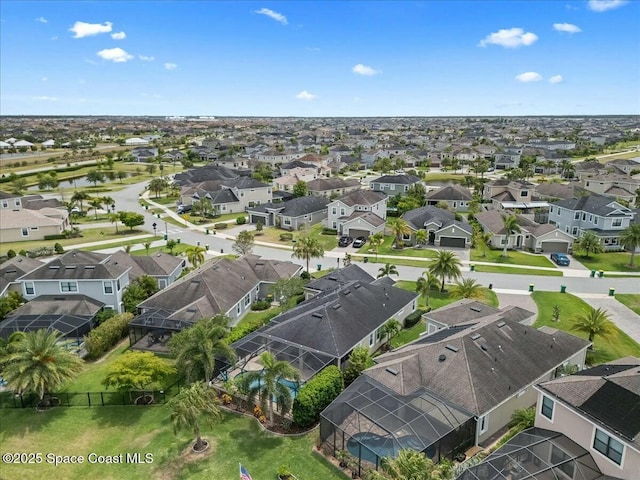 birds eye view of property featuring a residential view and a water view