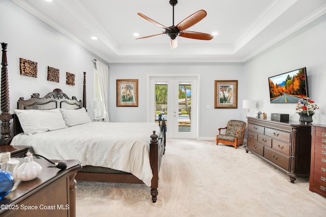 bedroom with french doors, crown molding, a raised ceiling, light colored carpet, and access to outside