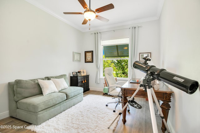 office featuring ceiling fan, ornamental molding, baseboards, and wood finished floors