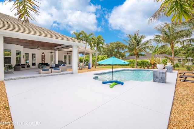 outdoor pool featuring a patio, an outdoor living space, a ceiling fan, and french doors