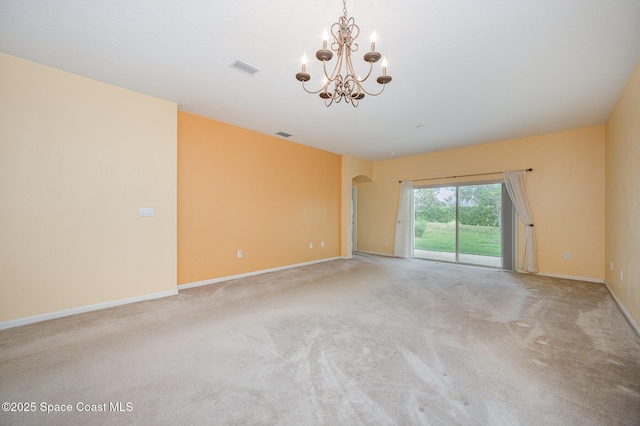 6921 Abbeyville Rd, Melbourne, FL 32940 - carpeted spare room with a chandelier, visible vents, arched walkways, and baseboards