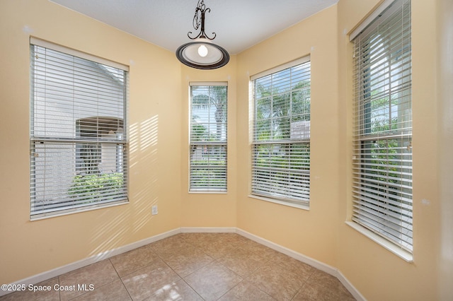6921 Abbeyville Rd, Melbourne, FL 32940 - tiled spare room with baseboards