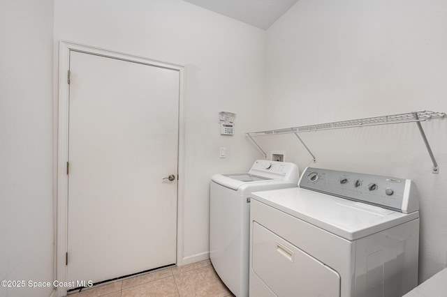 6921 Abbeyville Rd, Melbourne, FL 32940 - laundry area with light tile patterned floors, independent washer and dryer, and laundry area