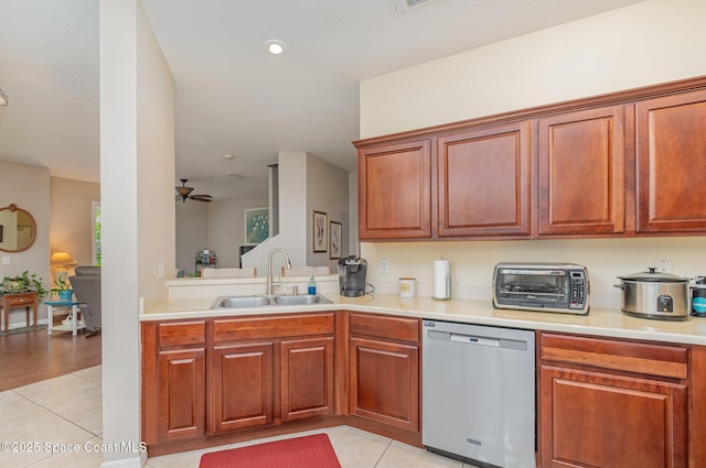 3321 San Jacinto Cir, Sanford, FL 32771 - kitchen featuring light countertops, light tile patterned floors, a sink, and dishwasher