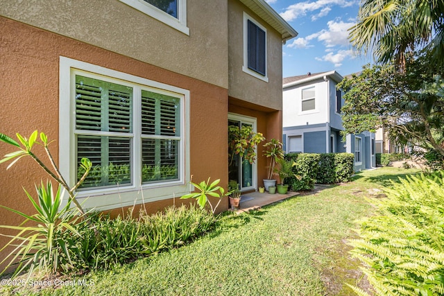 3321 San Jacinto Cir, Sanford, FL 32771 - exterior space featuring stucco siding and a yard