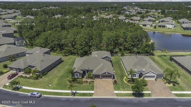 drone / aerial view with a water view and a residential view