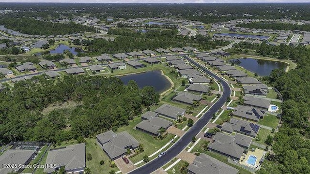 birds eye view of property featuring a residential view and a water view
