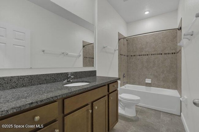 full bathroom with vanity, bathing tub / shower combination, and toilet