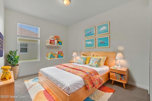 bedroom with baseboards and carpet