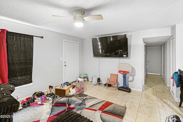 tiled living room featuring a textured ceiling and ceiling fan