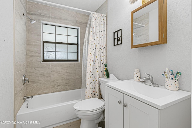 full bathroom with a textured wall, toilet, vanity, and shower / bathtub combination with curtain