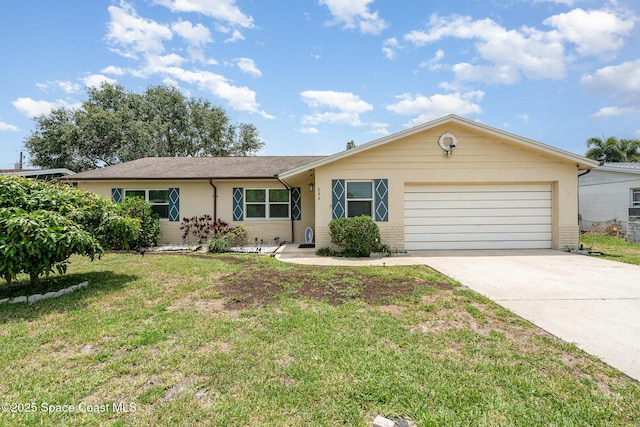 285 Hickory Ave, Merritt Island, FL 32953 - ranch-style home with a garage, driveway, and a front lawn