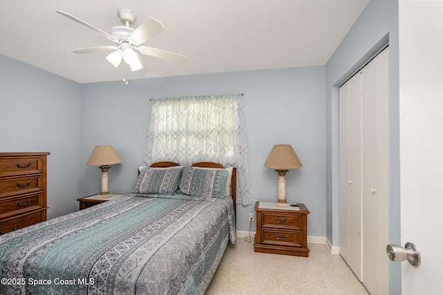 285 Hickory Ave, Merritt Island, FL 32953 - bedroom featuring a closet, speckle patterned floor, baseboards, and ceiling fan