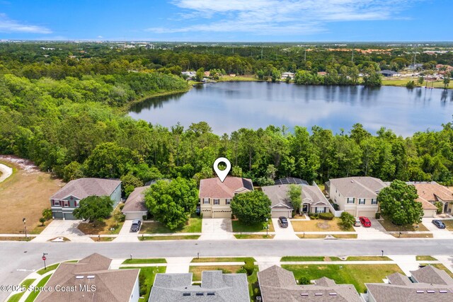 555 Carey Way, Orlando, FL 32825 - aerial view of residential area featuring a nearby body of water and a forest