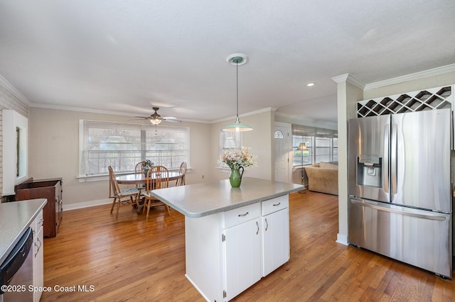 4320 Crooked Mile Rd, Merritt Island, FL 32952 - kitchen with plenty of natural light, ornamental molding, appliances with stainless steel finishes, and ceiling fan
