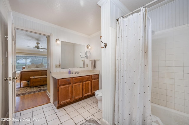 4320 Crooked Mile Rd, Merritt Island, FL 32952 - ensuite bathroom with a ceiling fan, crown molding, tile patterned flooring, vanity, and toilet