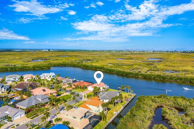 aerial view featuring a water view and a residential view