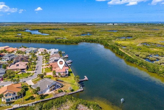 drone / aerial view featuring a residential view and a water view