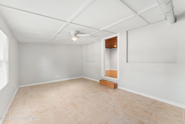 unfurnished room featuring baseboards, ceiling fan, and tile patterned flooring