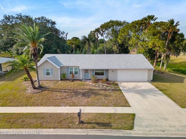ranch-style house with a garage, a front lawn, and concrete driveway