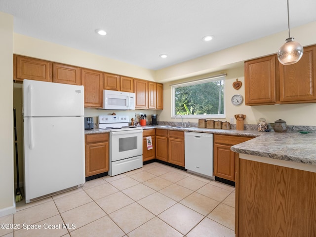 kitchen featuring recessed lighting, white appliances, decorative light fixtures, a sink, and light tile patterned flooring