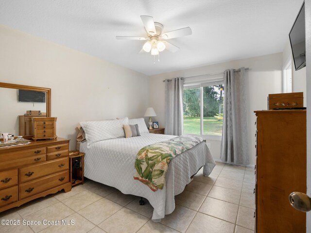 bedroom with light tile patterned flooring and ceiling fan