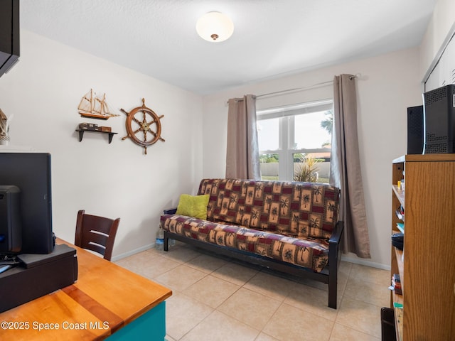 home office featuring light tile patterned floors and baseboards