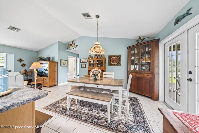 101 Joy Haven Dr, Sebastian, FL 32958 - dining area featuring lofted ceiling, light tile patterned flooring, and visible vents