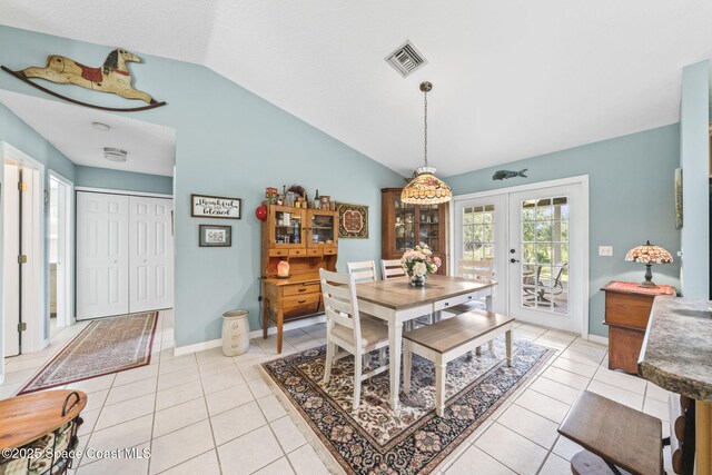 101 Joy Haven Dr, Sebastian, FL 32958 - dining space featuring light tile patterned floors, visible vents, french doors, and lofted ceiling