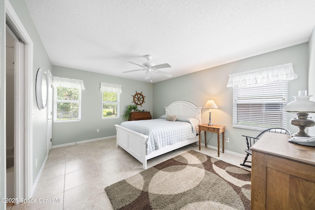 101 Joy Haven Dr, Sebastian, FL 32958 - bedroom featuring baseboards, a ceiling fan, a textured ceiling, and light tile patterned flooring
