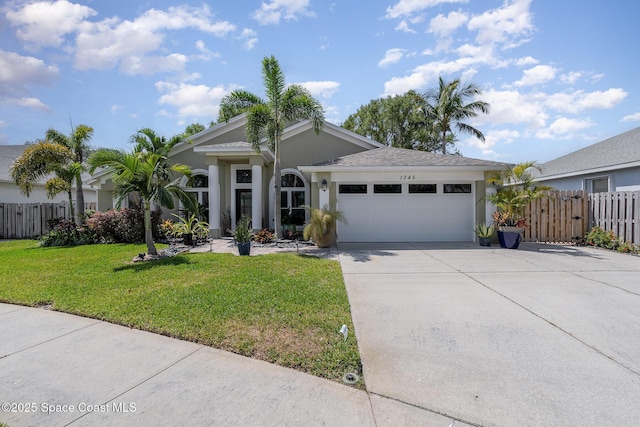 ranch-style home featuring concrete driveway, a front lawn, fence, a garage, and stucco siding