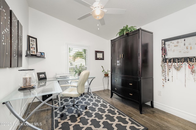 office area featuring lofted ceiling, a ceiling fan, dark wood-style floors, and baseboards