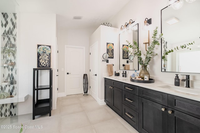 full bath with visible vents, a sink, and double vanity
