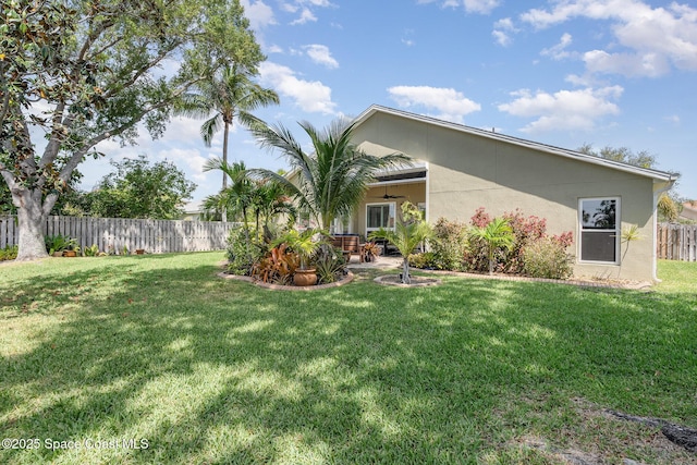 view of yard with a patio and fence