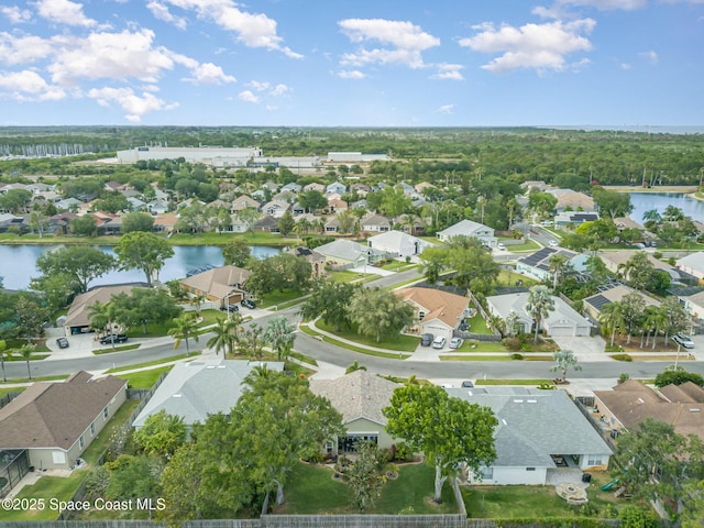 birds eye view of property featuring a residential view and a water view