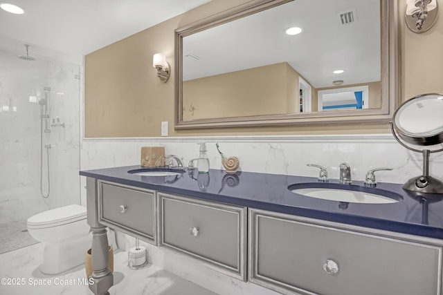 full bathroom with visible vents, a marble finish shower, marble finish floor, and a sink