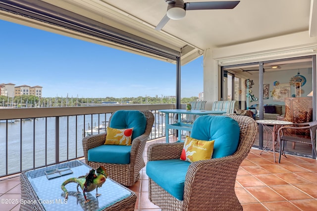 exterior space featuring a ceiling fan and a water view