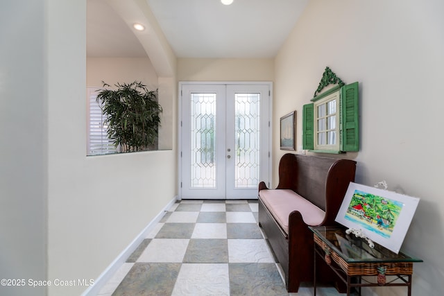 foyer with recessed lighting, french doors, and baseboards