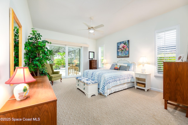 carpeted bedroom with a ceiling fan and baseboards